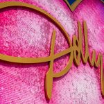 dolly parton large pink sequined heart tabela altin cursive lettering against blue