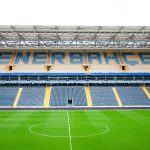 fenerbahce stadium showcasing empty stands pristine green field