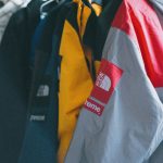 supreme collection colorful jackets hanging clothing rack indoors
