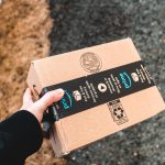 amazon kisi holding cardboard prime package snowy kentsel sidewalk