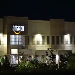 amazon warehouse bina illuminated gece trees signage