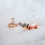 elie saab elegant elie saab perfume bottle surrounded soft flower petals textile