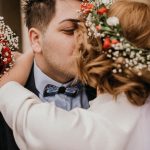 nika bride groom sharing romantic kiss their wedding gun symbolizing love