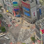 rakuten aerial gorunum shibuya crossing intersection pedestrians vehicles tokyo striking overhead